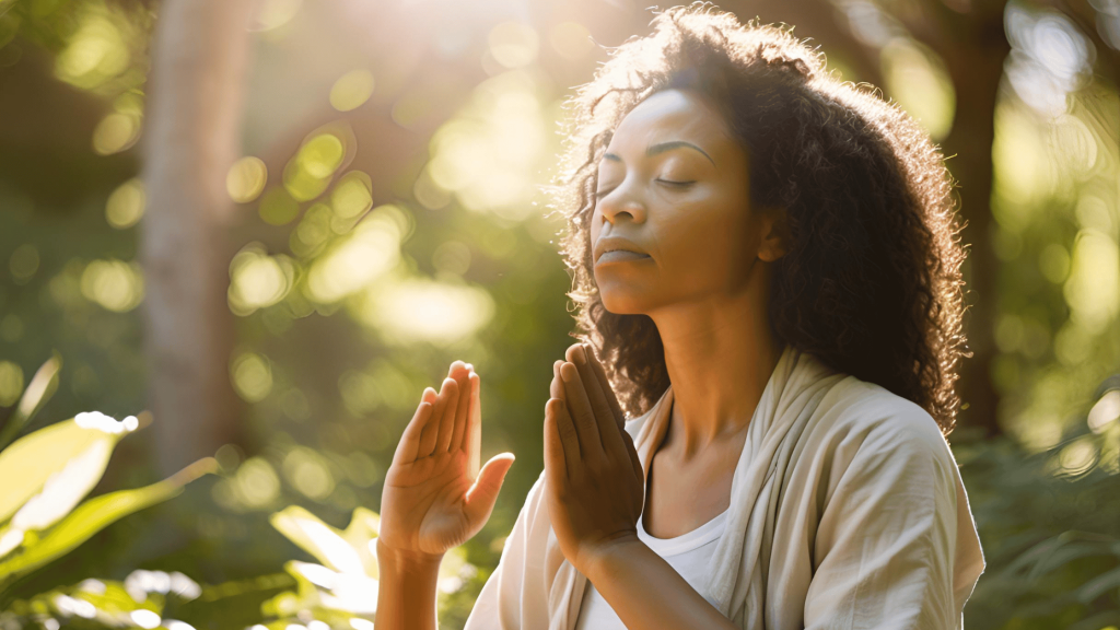 A serene woman stretching outdoors at sunrise, symbolizing the connection between physical health and emotional recovery.